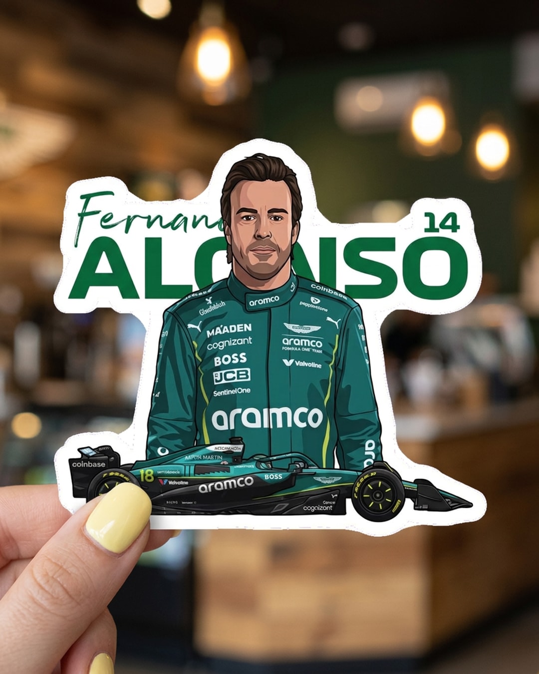 Pegatina Fernando Alonso F1 con coche y dorsal 14 sostenida en la mano, a tamaño real