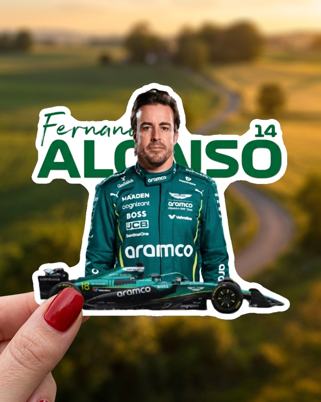 Pegatina Fernando Alonso con coche de F1 y dorsal 14 sostenida en la mano, a tamaño real
