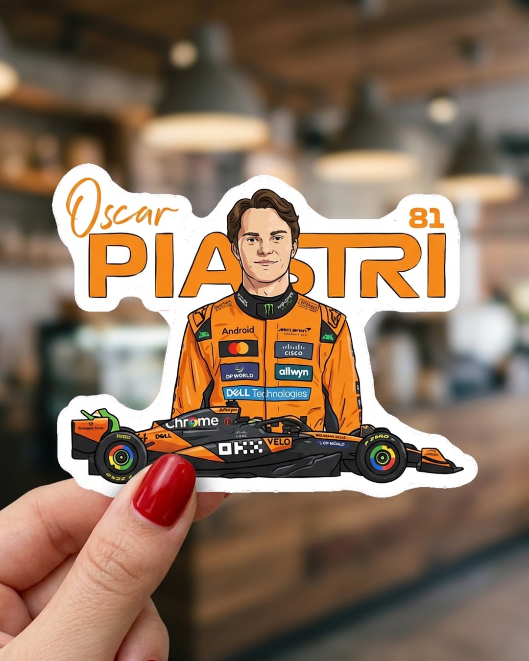 Pegatina Oscar Piastri con monoplaza de F1 sostenida en la mano, a tamaño real